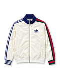 Front view of the off-white adidas x Gucci track jacket featuring blue Three Stripes on the left sleeve, Gucci red and green Web stripes on the right sleeve, a navy stand-up collar, co-branded adidas Trefoil and Gucci chest logo, full-length zipper, and front patch pockets.