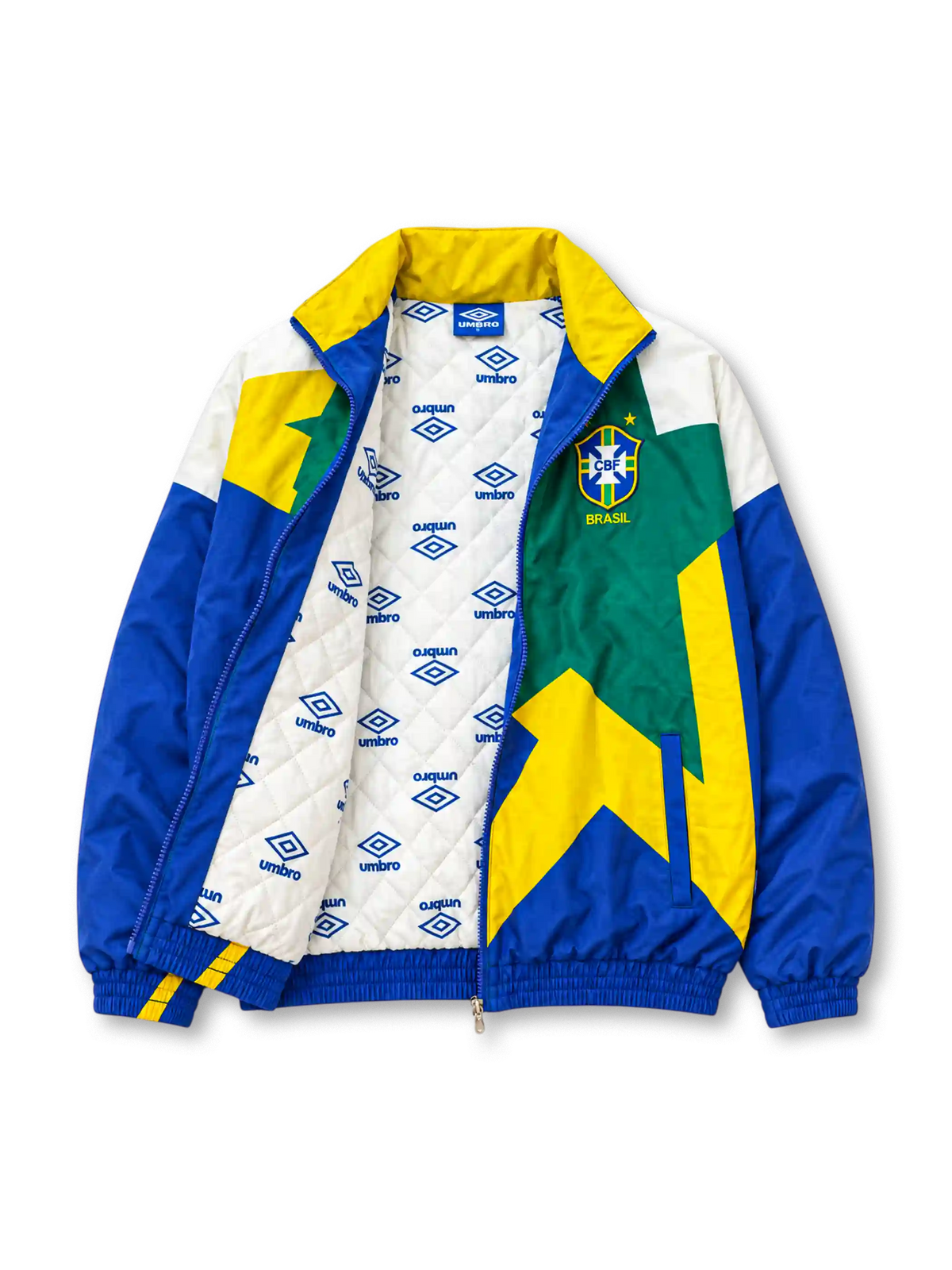 Front view of the Brazil 1993-94 Umbro national team track jacket featuring a large geometric star graphic in yellow and green, royal blue sleeves, white shoulder panels, an embroidered CBF crest, Umbro logo, full zip closure, and elasticated cuffs and hem.