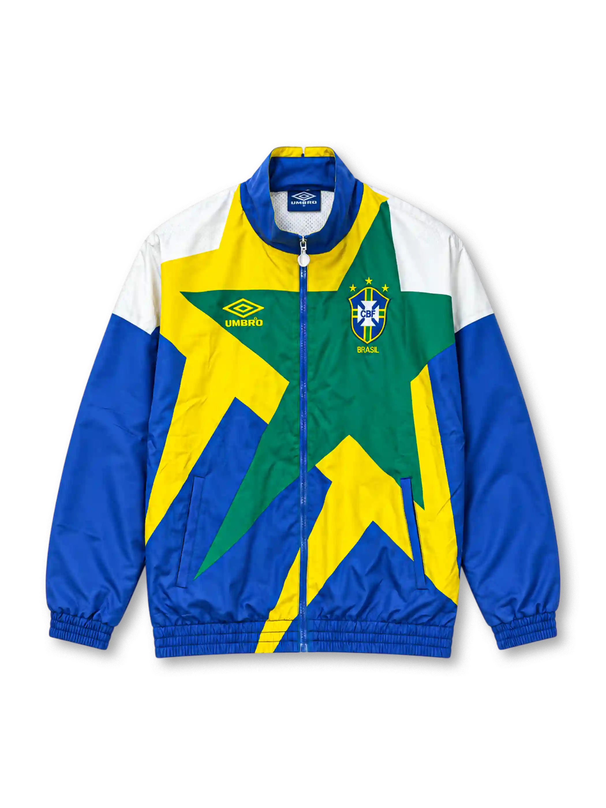 Front view of the Brazil 1993-94 Umbro national team track jacket featuring a large geometric star graphic in yellow and green, royal blue sleeves, white shoulder panels, an embroidered CBF crest, Umbro logo, full zip closure, and elasticated cuffs and hem.