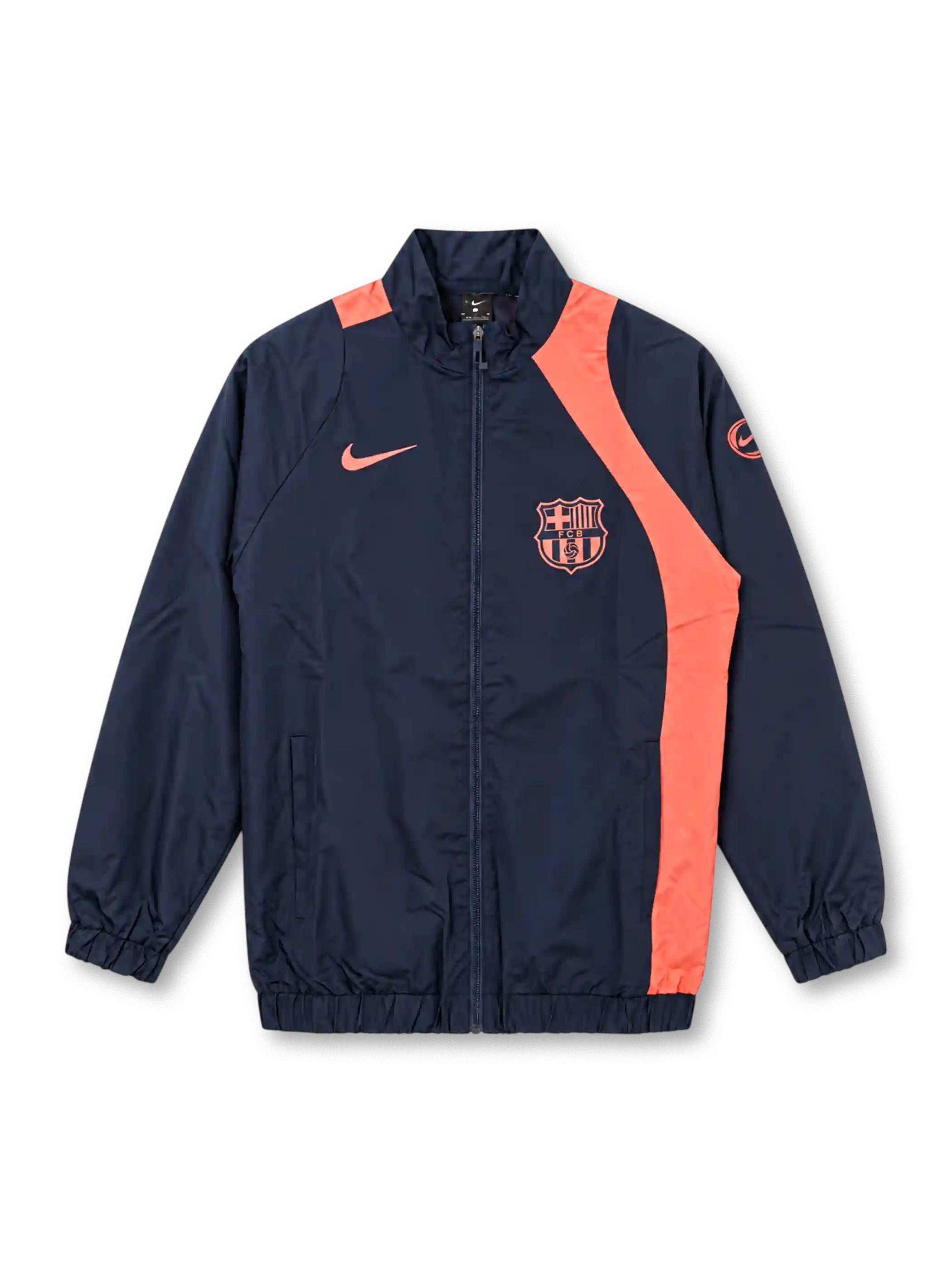 Front view of the FC Barcelona 2025-26 Nike Third T90 track jacket in navy blue with coral-orange curved panels, matching Nike Swoosh and Barcelona crest, Total 90 sleeve emblem, full-length front zipper, raised collar, side pockets, and elasticated cuffs and hem.