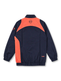 Front view of the FC Barcelona 2025-26 Nike Third T90 track jacket in navy blue with coral-orange curved panels, matching Nike Swoosh and Barcelona crest, Total 90 sleeve emblem, full-length front zipper, raised collar, side pockets, and elasticated cuffs and hem.