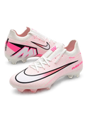 Nike Mercurial FG soccer cleats in white and pink with fine pink streak graphics, a black-outlined Swoosh fading to coral pink, pink Air Zoom heel lettering, and an oversized M heel logo, shown as a pair.