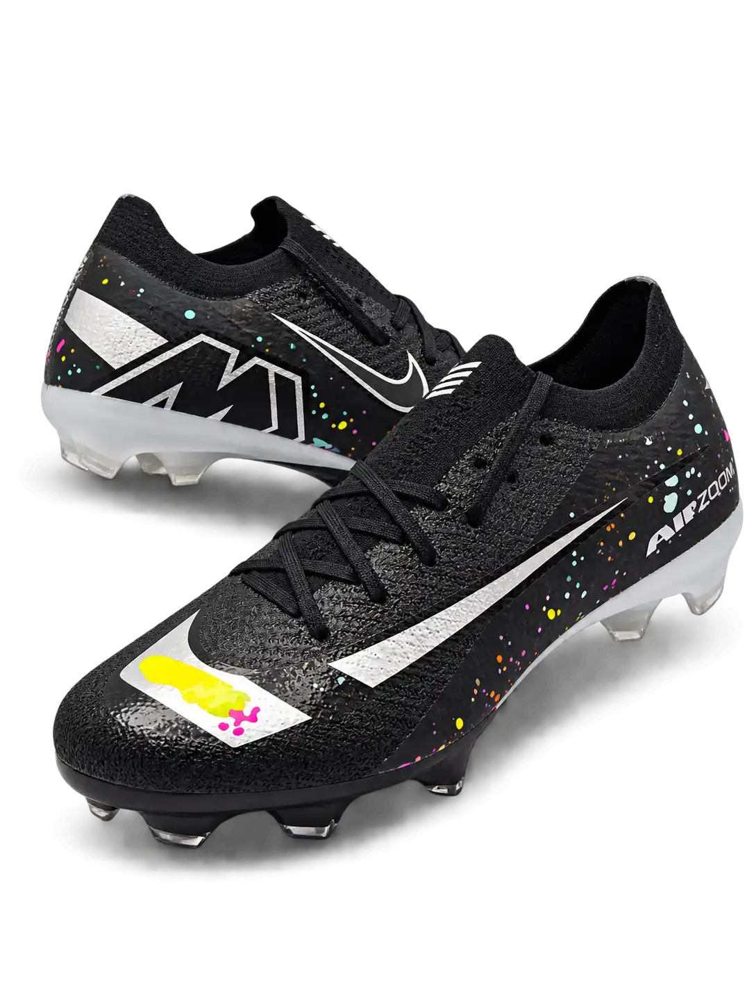 Nike Mercurial FG soccer cleats in black with multicolor confetti speckles, a metallic silver Swoosh, a yellow and pink painted toe graphic, white Air Zoom heel lettering, and an oversized M heel logo, shown as a pair.
