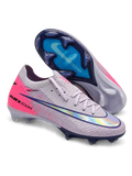 Nike Mercurial FG soccer cleats in lilac with a pink heel panel, pink paint-splatter accents, a navy-outlined holographic Swoosh, and Air Zoom heel lettering, plus a navy soleplate with a blue Air Zoom window, shown from the lateral side and outsole.