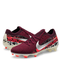 Burgundy Nike Mercurial-style FG soccer cleats with metallic silver Swoosh, black and red Safari-inspired heel graphics, cream outsole, and red stud accents.