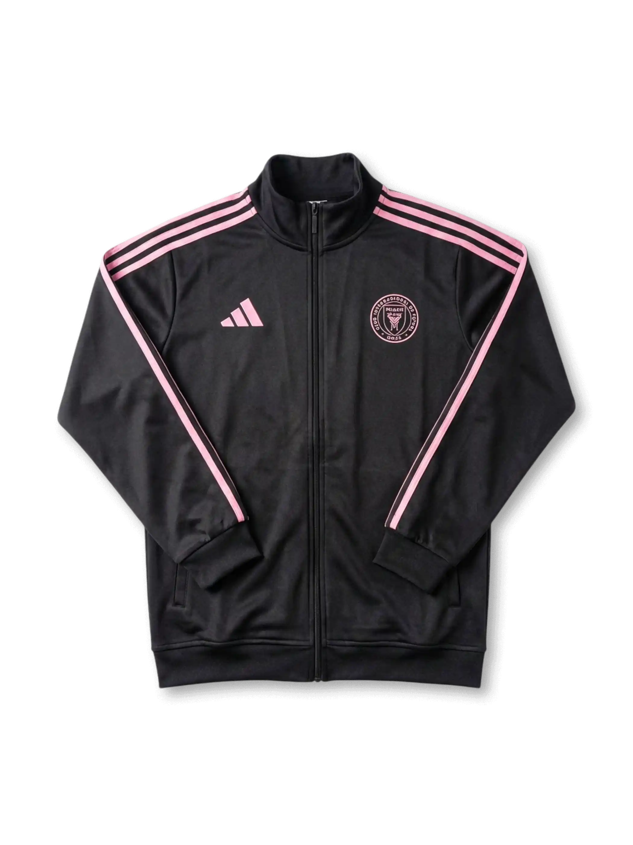 Inter Miami CF adidas track jacket in black with pink Three Stripes on sleeves, pink adidas logo at left chest, tonal pink circular Inter Miami CF crest at right chest, ribbed collar and cuffs, twin zip pockets