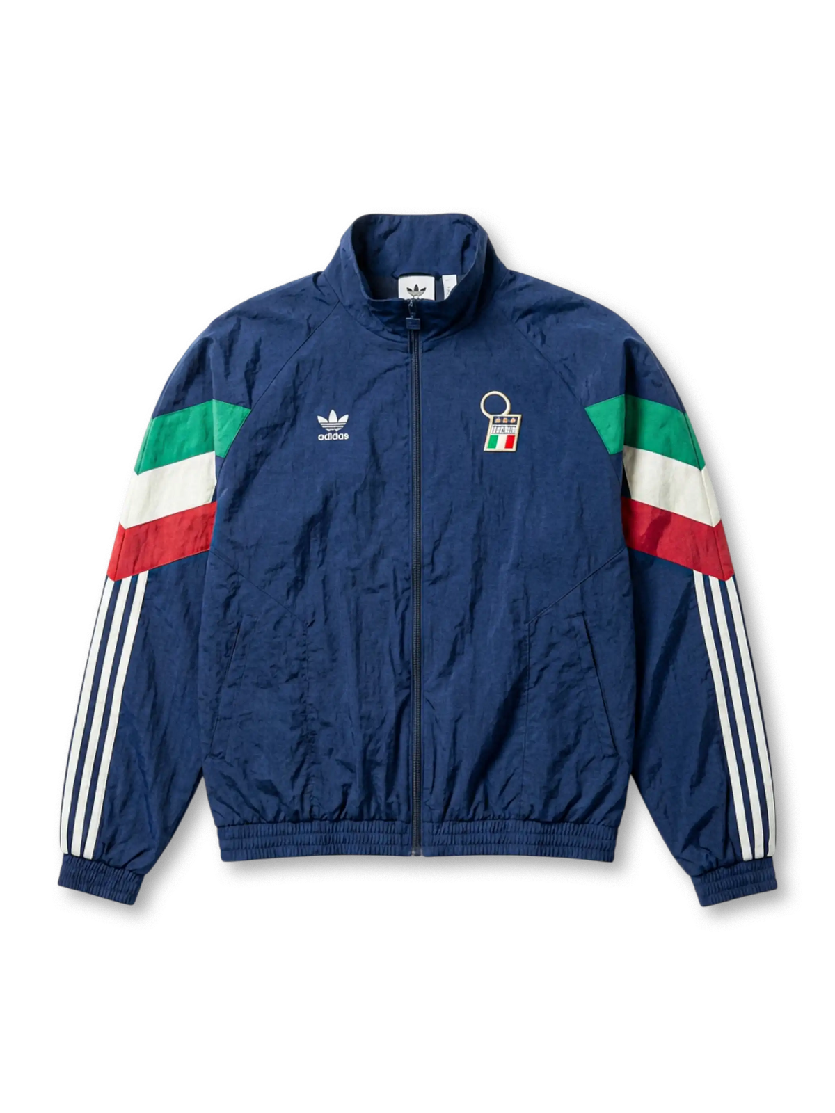 Italy national team adidas Originals 1994 retro track jacket in navy with tricolor flag sleeve panels, FIGC crest at chest, Trefoil logo, and Three Stripes on sleeves