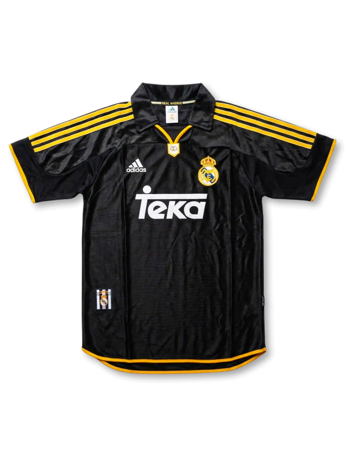 Front view of Real Madrid 1999-2000 away shirt in black with yellow trim, Teka sponsor, adidas logo, club crest, and polo collar.