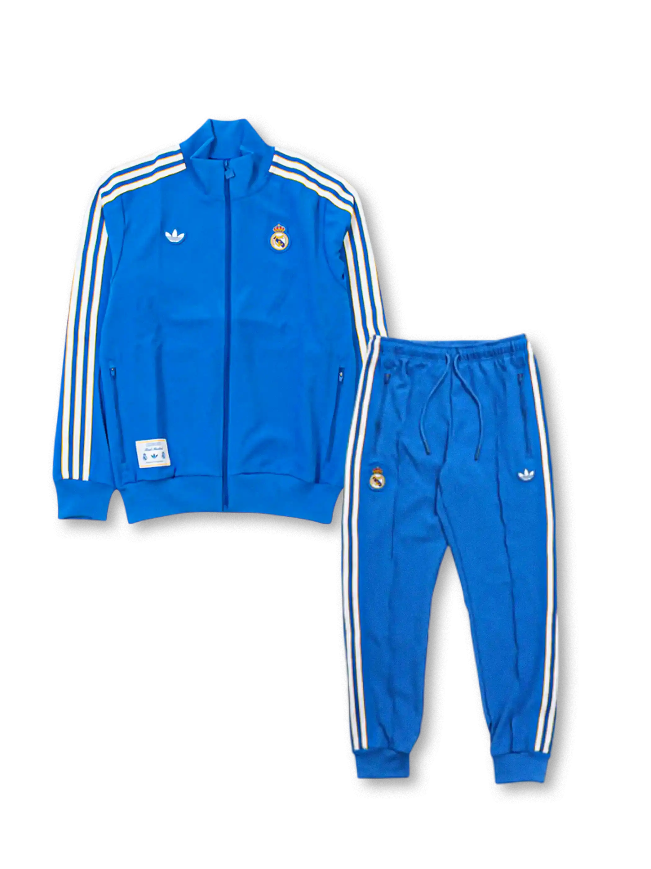 Real Madrid adidas Originals Terrace Icons tracksuit in royal blue with off-white Three Stripes on jacket and pants, embroidered Real Madrid crests, Trefoil logo, and co-branded woven label patch at jacket hem