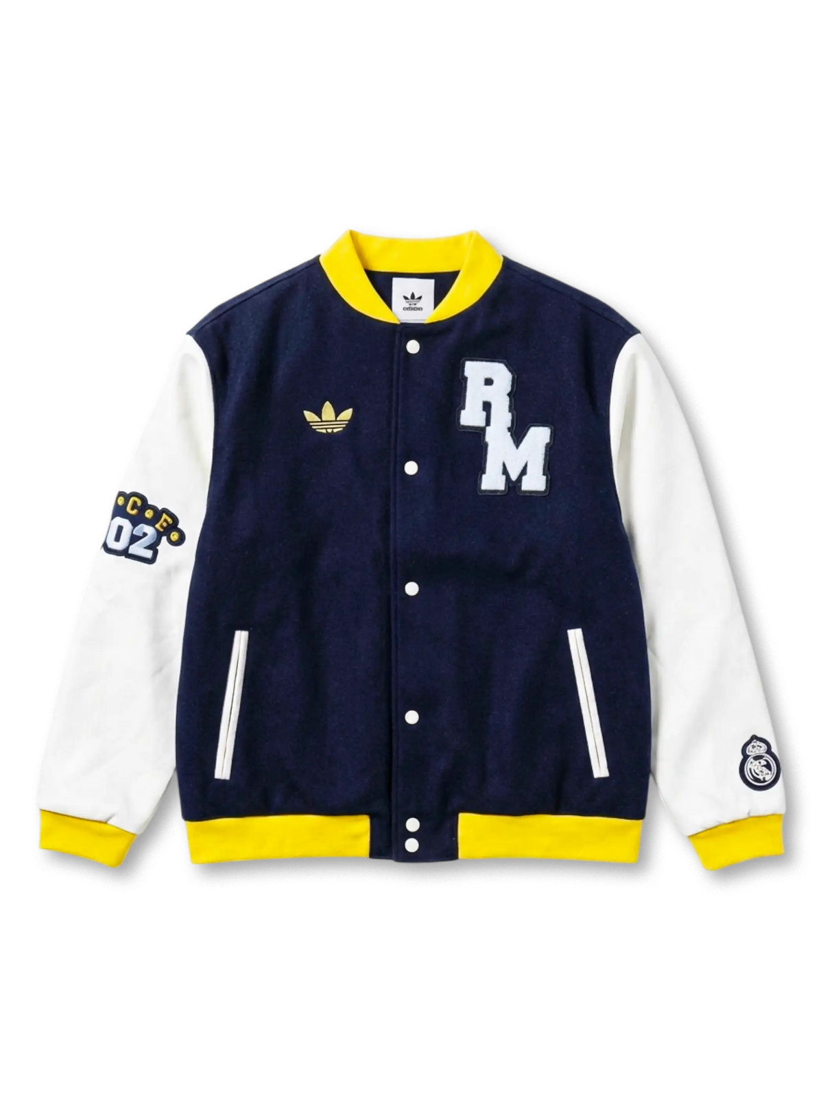 Real Madrid adidas Originals varsity jacket with navy wool body, white leather sleeves, yellow ribbed trim, chenille RM chest patch, gold Trefoil, CE02 sleeve patch, and Real Madrid crest on right sleeve