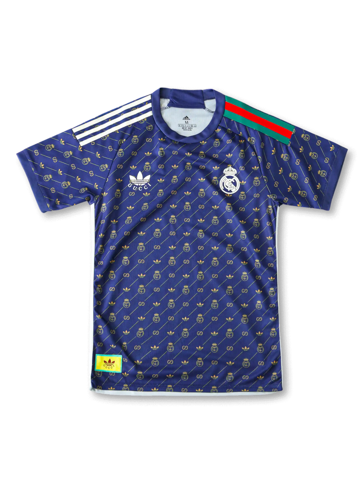 Front view of Real Madrid special edition shirt in navy with gold monogram pattern, crest, trefoil-style chest logo, and striped shoulder detail.