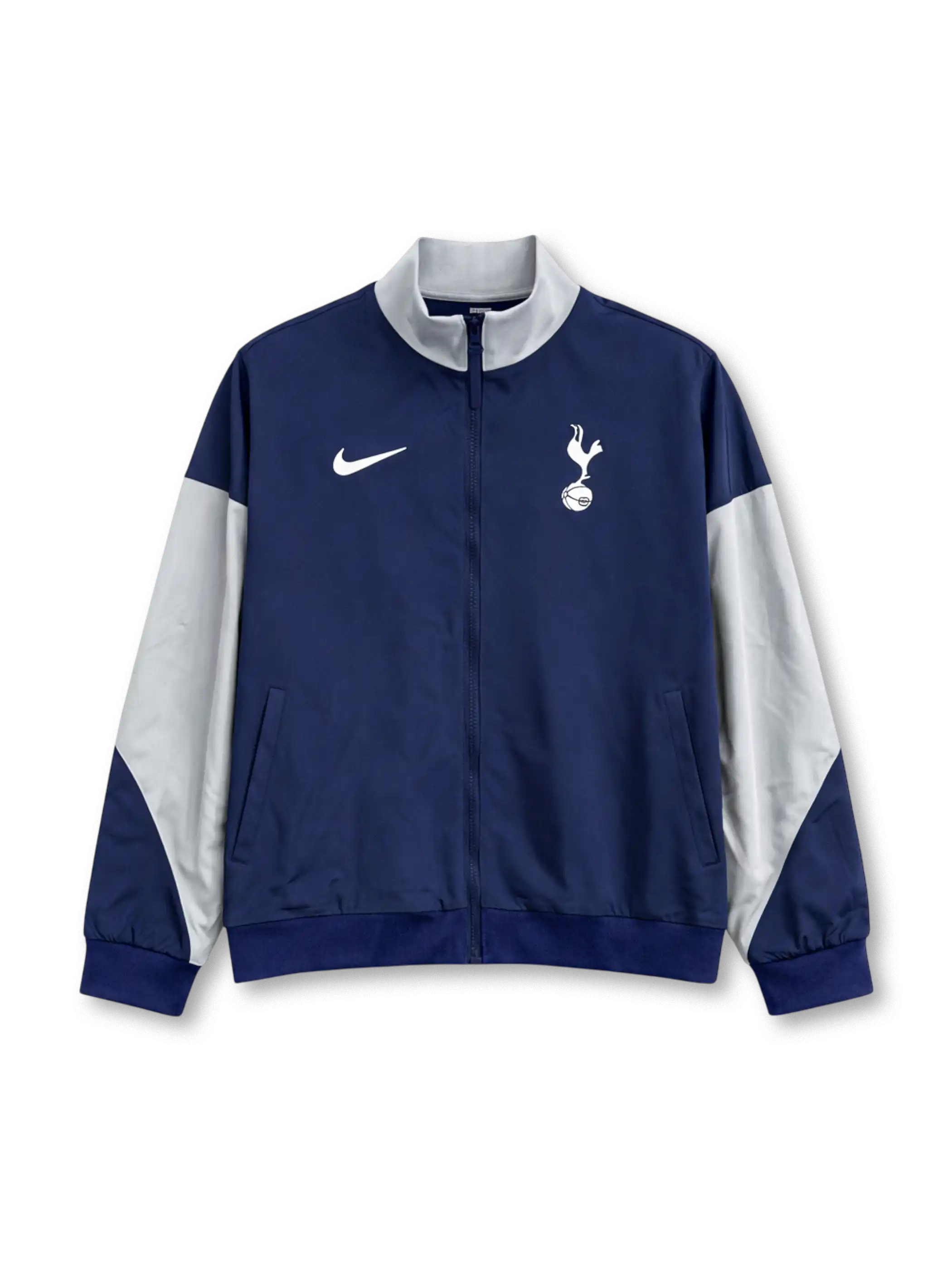 Tottenham Hotspur Nike track jacket in navy with white raglan sleeve panels, white stand collar, Nike Swoosh at left chest, embroidered cockerel crest at right chest