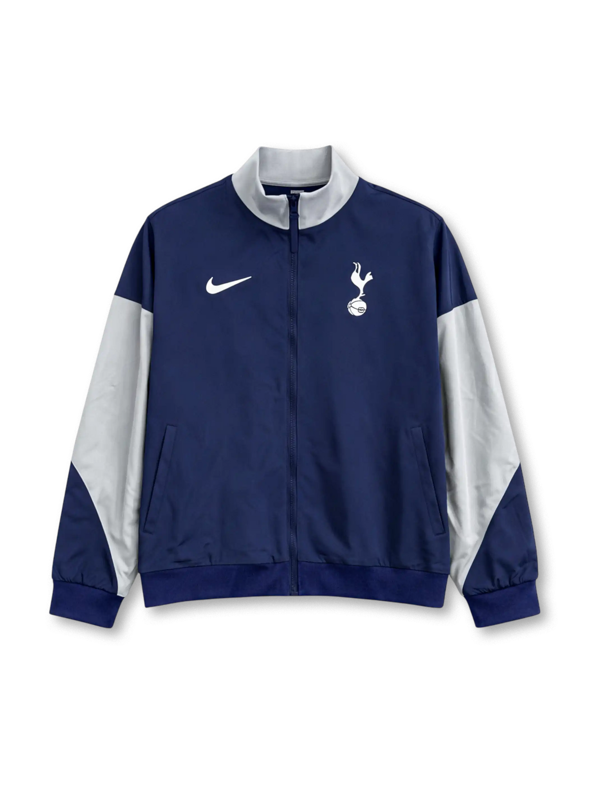 Tottenham Hotspur Nike track jacket in navy with white raglan sleeve panels, white stand collar, Nike Swoosh at left chest, embroidered cockerel crest at right chest