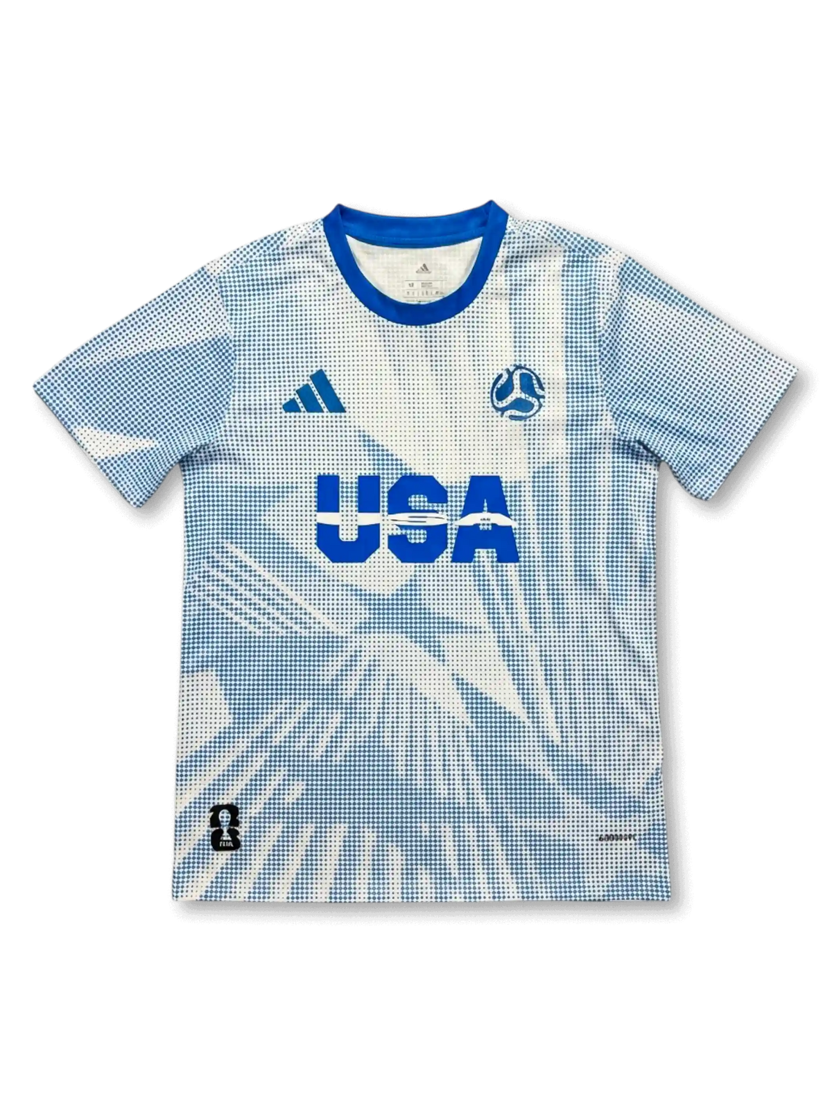USA national team adidas 2026 FIFA World Cup pre-match jersey in white with allover blue halftone dot print, bold USA lettering at center chest, adidas logo at left, FIFA World Cup 2026 ball badge at right, royal blue crew collar, host nation badge at lower left hem

