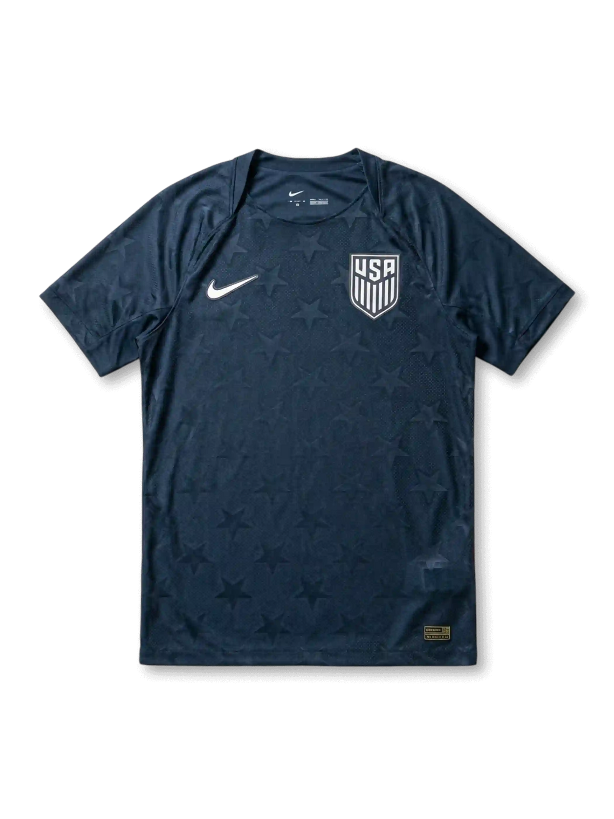 USA national team Nike 2026/27 Authentic (Player Issue) away jersey in navy with tonal allover star jacquard texture, white Swoosh at left chest, white USA shield crest at right chest, plain navy crew collar and cuffs, gold authentication label at lower right hem