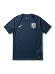 USA national team Nike 2026/27 Authentic (Player Issue) away jersey in navy with tonal allover star jacquard texture, white Swoosh at left chest, white USA shield crest at right chest, plain navy crew collar and cuffs, gold authentication label at lower right hem