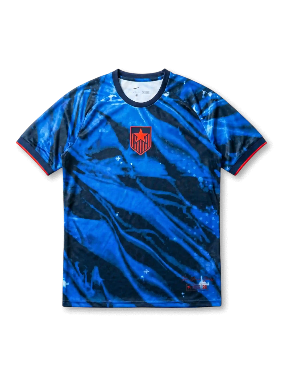 USA national team Nike 2028 Los Angeles Olympics Special Edition Authentic (Player Issue) jersey with royal blue and navy tie-dye marble allover print, red alternate star-shield crest at left chest, navy crew collar, red sleeve cuff bands, LA 2028 tournament designation at lower hem