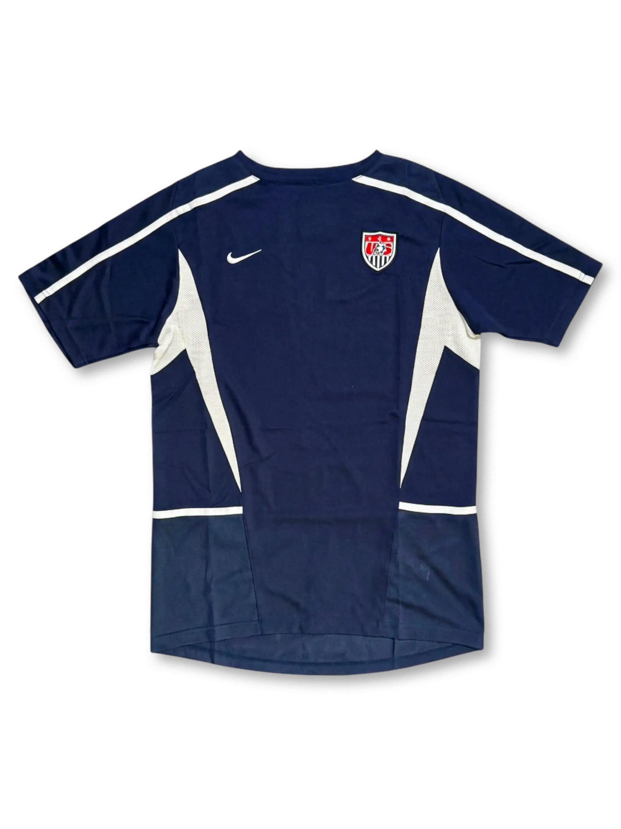 USA national team Nike training jersey in navy with white mesh side panels, white shoulder piping, Nike Swoosh at left chest, embroidered US Soccer shield crest at right chest
