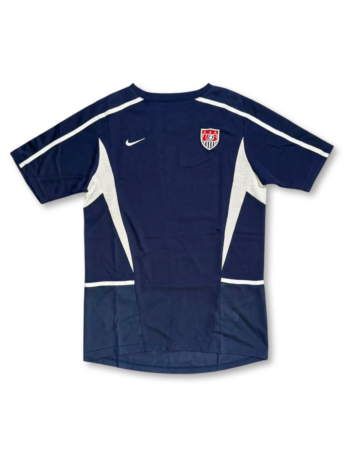 USA national team Nike training jersey in navy with white mesh side panels, white shoulder piping, Nike Swoosh at left chest, embroidered US Soccer shield crest at right chest